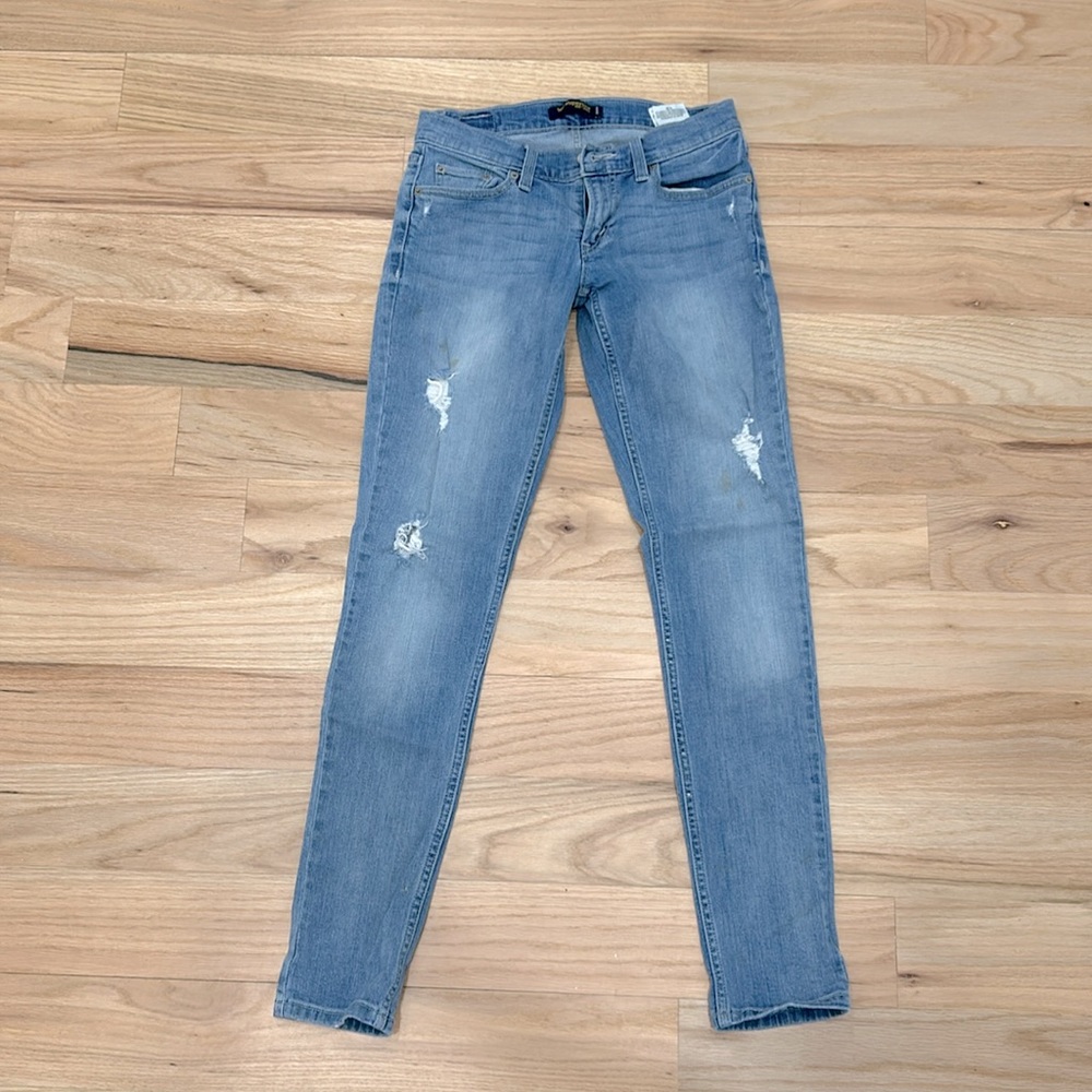 Low rise distressed skinny jeans, light wash